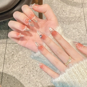 Almond shaped peach gradient press-on nails with silver aurora laser and diamond accents