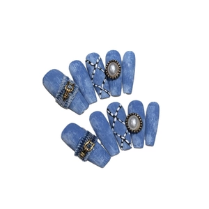 Denim style press-on nails with cross details, pearls and textured fabric design