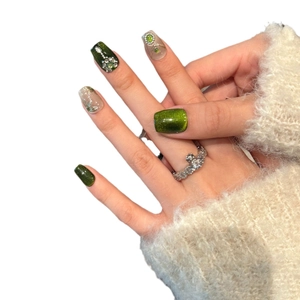 Handmade emerald green cat eye press-on nails with pearl and diamond accents