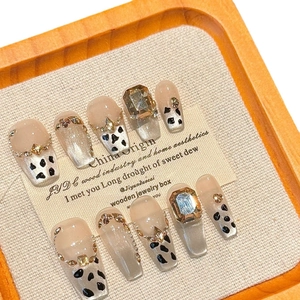 Handmade leopard and cow print coffin nails with 3D rhinestones in a display box