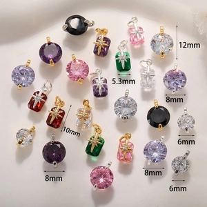 Macro view of multi-color planet charms with zircon stones in various sizes and shapes