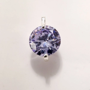 Macro shot of faceted lavender crystal pendant with silver-plated minimalist claw setting