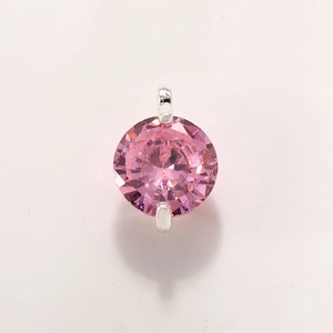 Detail of pink crystal planet pendant with faceted stone in gold-plated claw setting