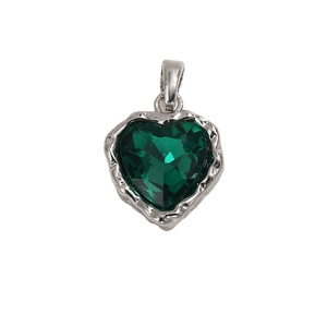 Green heart-shaped crystal pendant with silver lava textured metal frame on white background