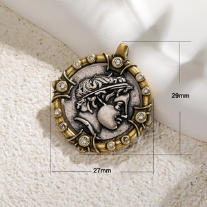Antique gold finish coin pendant with Greek relief and 12 cubic zirconia stones