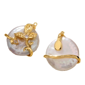Baroque freshwater pearl pendants with gold flower and wave accents on white background