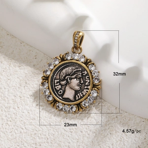 Macro detail of antique gold coin pendant with portrait carving and zircon frame