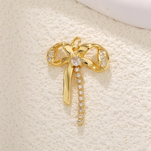 Gold plated bow pendant with zircon crystals and polished finish for DIY jewelry