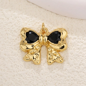 Gold plated bow pendant with black heart stones and cubic zirconia for DIY jewelry