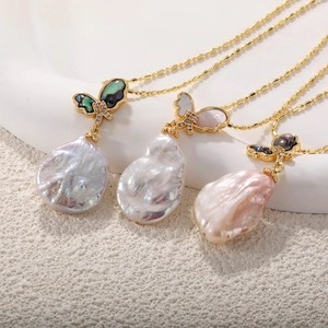 Golden ball chain necklace with baroque pearls and butterfly pendants in three colors