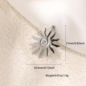 Macro view of silver sun pendant showing precise dimensions and polished spiral pattern