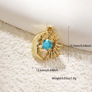 Detail of gold sun and moon pendant with turquoise stone, 13.7mm by 12.6mm size