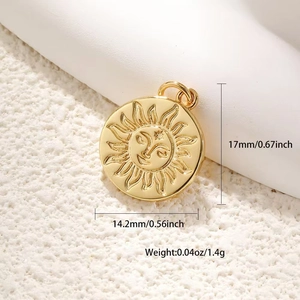 Detail of gold sun face pendant with embossed texture and size 17mm x 14.2mm