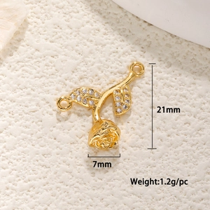 Macro shot of 21mm rose pendant connector in gold finish with clear zircon leaf accents
