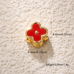 Detailed size view of a 9.4mm four-leaf clover gold plated pendant with red enamel