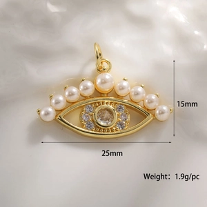Detailed view of evil eye gold pendant with white pearls and 25mm dimensions