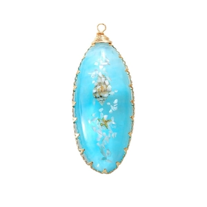 Blue resin ocean pendant with seashell and starfish in gold copper wire wrapping