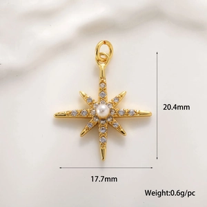 Macro shot of gold North Star pendant with pearl and zircon inlay for jewelry making