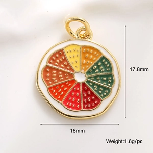 Macro view of a colorful rainbow enamel citrus fruit slice pendant with gold plating