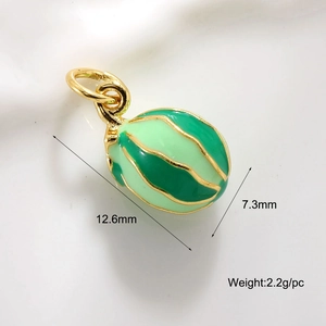 Macro shot of green enamel fruit pendant with gold details, 12.6mm size and 2.2g weight