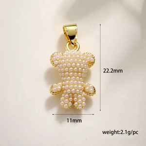 Golden bear pendant with inlaid pearls and horseshoe bail, 22.2mm by 11mm size