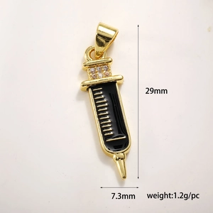 Detailed view of gold medical syringe pendant with dimensions 29mm height and 7.3mm width