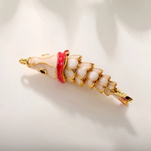 Detailed macro view of 18k gold plated koi fish pendant with pink and white enamel scales