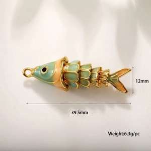 Macro view of 18k gold plated enamel fish pendant showing 39.5mm length and dimensions