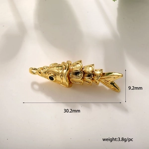 Macro shot of 18k gold plated fish pendant with detailed scales and dimensions