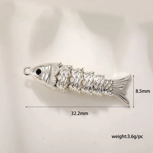 Detail view of silver fish pendant with 32.2mm length and 8.5mm width dimensions