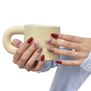 Handmade press-on nails featuring hand-painted plum blossoms in red, pink and silver
