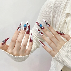 Handmade stiletto press-on nails with red-white color block and 3D gemstone accents