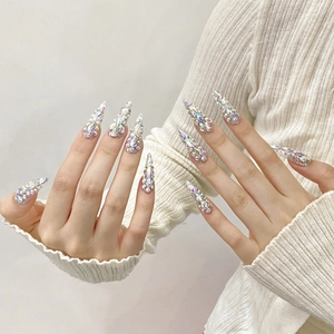 Handmade stiletto press-on nails with full iridescent AB rhinestones for a luxury look