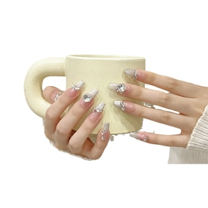 Handmade press-on nails with silver cat-eye glitter and large 3D rhinestones on long coffin shape