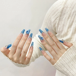 Blue glitter handmade press-on nails with rhinestones and pearls in ballerina shape
