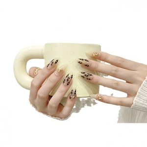 Handmade stiletto leopard print press-on nails with golden metal chain accents