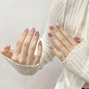 Handmade cat-eye press-on nails in mauve purple with elegant pearl and bead accents
