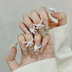 Handmade white butterfly press-on nails with silver cat-eye finish and pearl accents