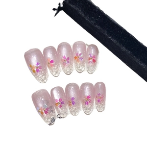 Pink aurora cherry blossom cat eye press-on nails with ice gradient and gold bead detail