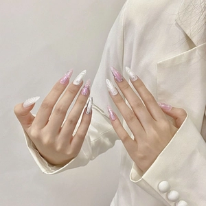 Pink and white cat-eye press-on nails with 3D embossed texture and white pearl accents