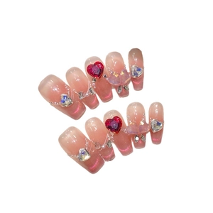 Handmade cat eye press-on nails with rose heart gems and 3D butterfly charms