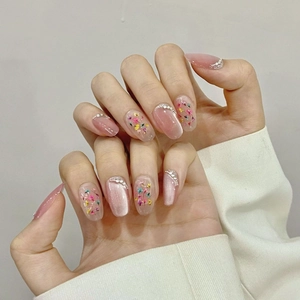 Handmade almond press-on nails with cat eye finish, dried flowers and pearls