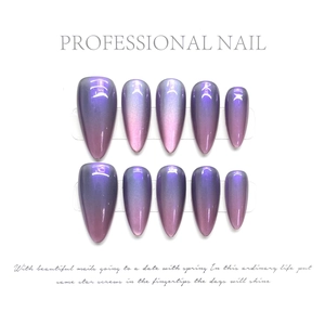 Detail of almond-shaped press-on nails with blue and purple metallic cat-eye gradient effect