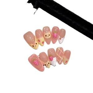 Handmade almond press-on nails featuring 3D strawberry and bear designs for girls
