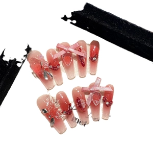 Gradient pink and red coffin press-on nails with 3D bows and heart gemstone charms