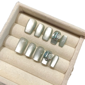 Handmade emerald cat eye press-on nails with 3D camellia flower and blue gemstone