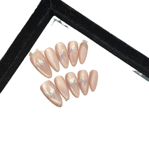 Sparkling champagne almond press-on nails with silver holographic wavy texture