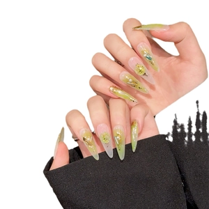 Handmade stiletto press-on nails with green marble pattern, cat-eye stones, and pearls