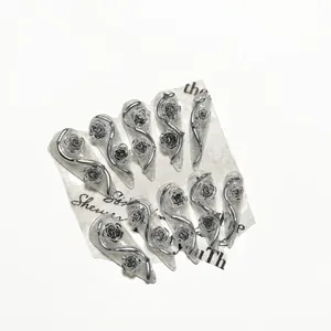 Handmade gothic press-on nails with 3D black roses and silver liquid metal vines