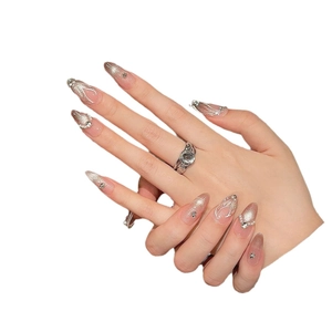 Handmade silver cat-eye press-on nails with pearls and rhinestones in almond shape